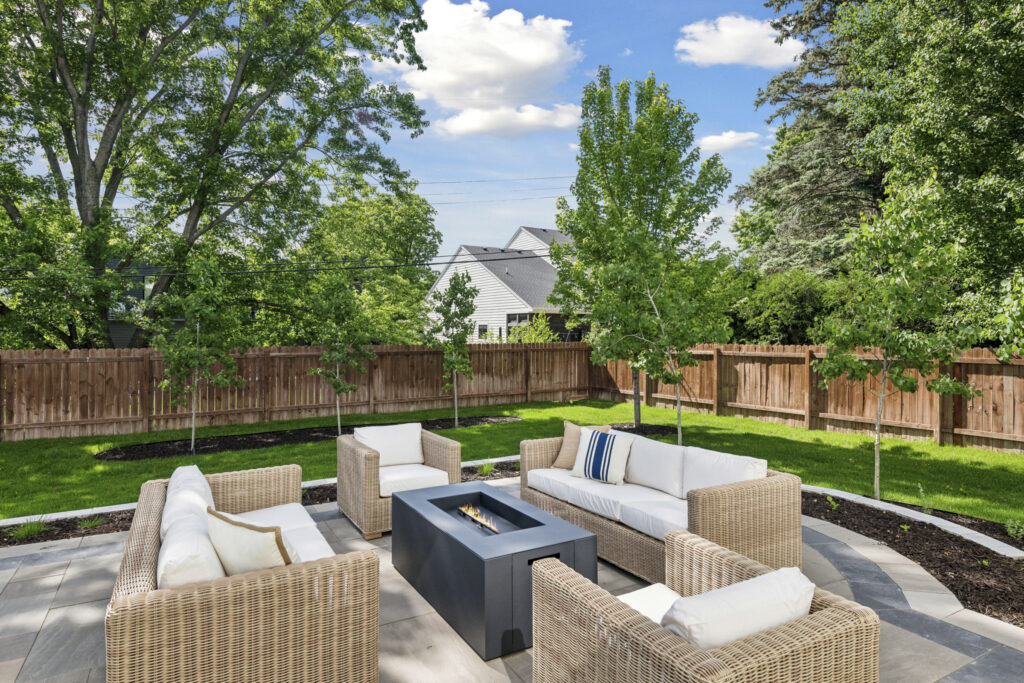 Backyard patio with fireplace and seating